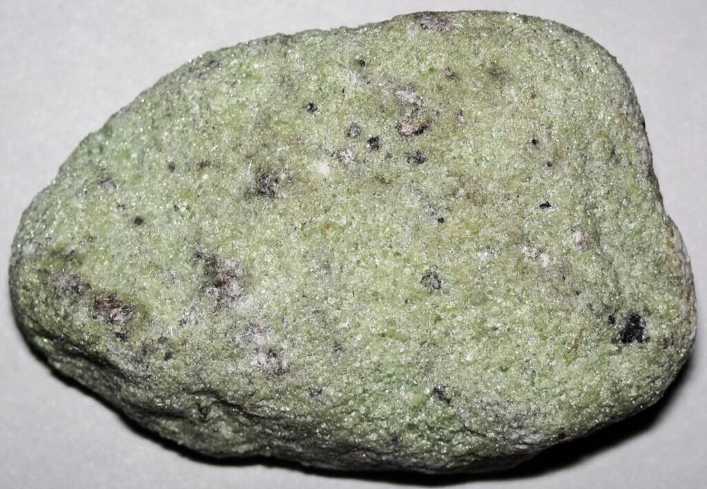 Dunite, a coarse-grained greenish ultramafic plutonic rock