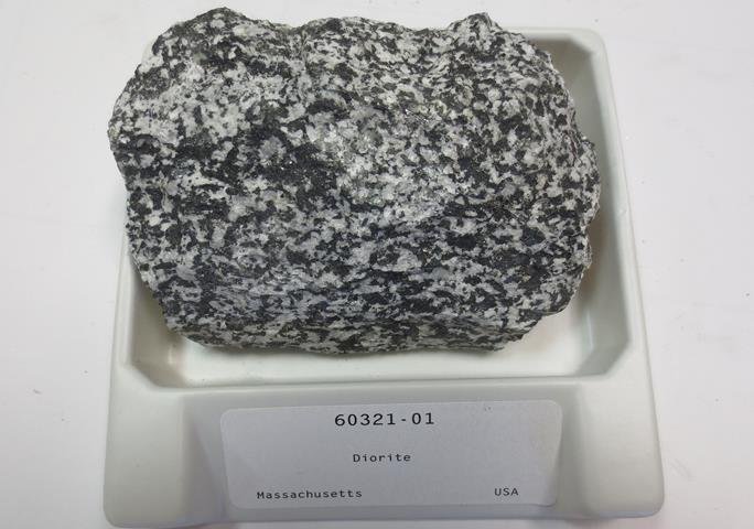 Coarse-grained medium to dark diorite rock with a salt and pepper look