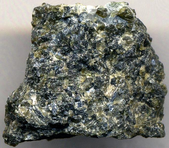 Dark-greenish to greenish-black Harzburgite rock from Stillwater Complex Montana