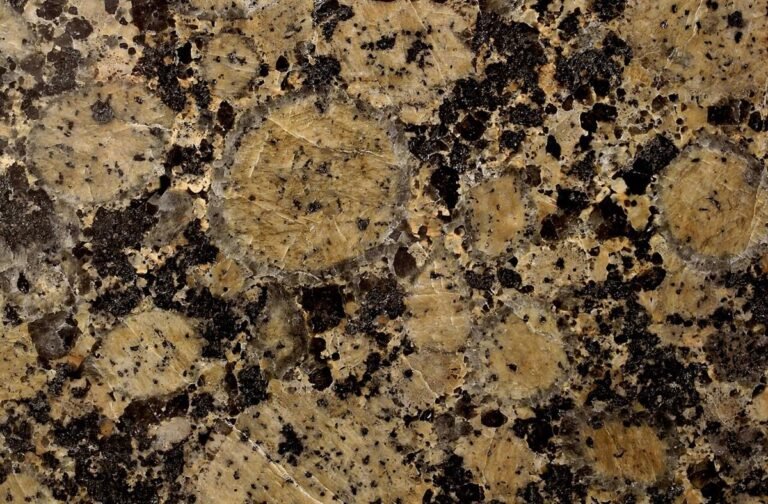 Rapakivi granites or texture with brownish K-feldspar rimmed by greyish Na-plagioclase